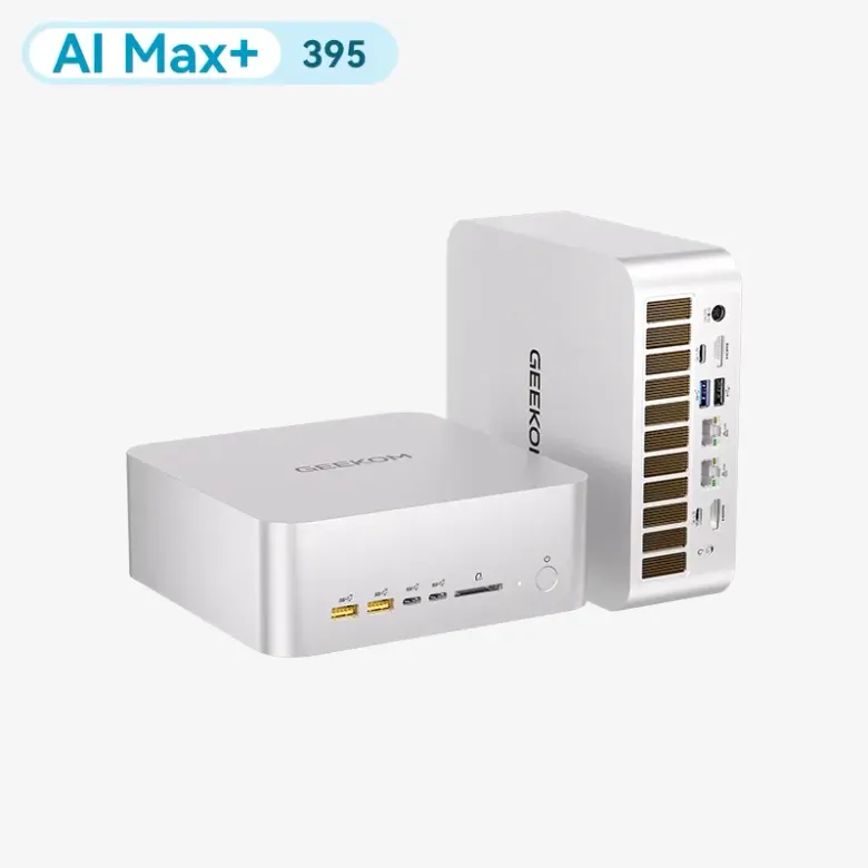 Dwa srebrne mini PC GEEKOM A9 Mega, jeden leżący i jeden postawiony pionowo, z portami z przodu i z tyłu